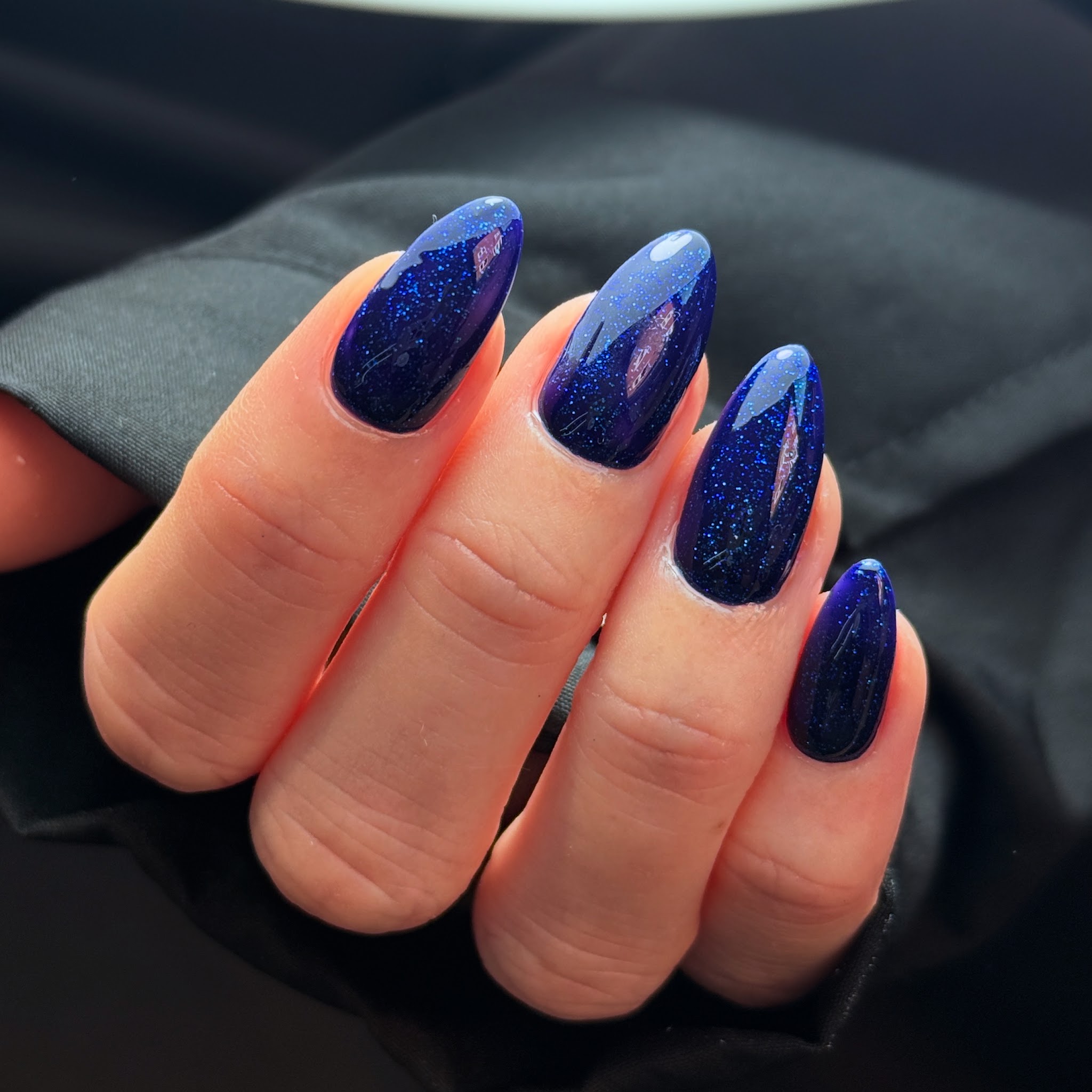 Navy glitter almond nails
